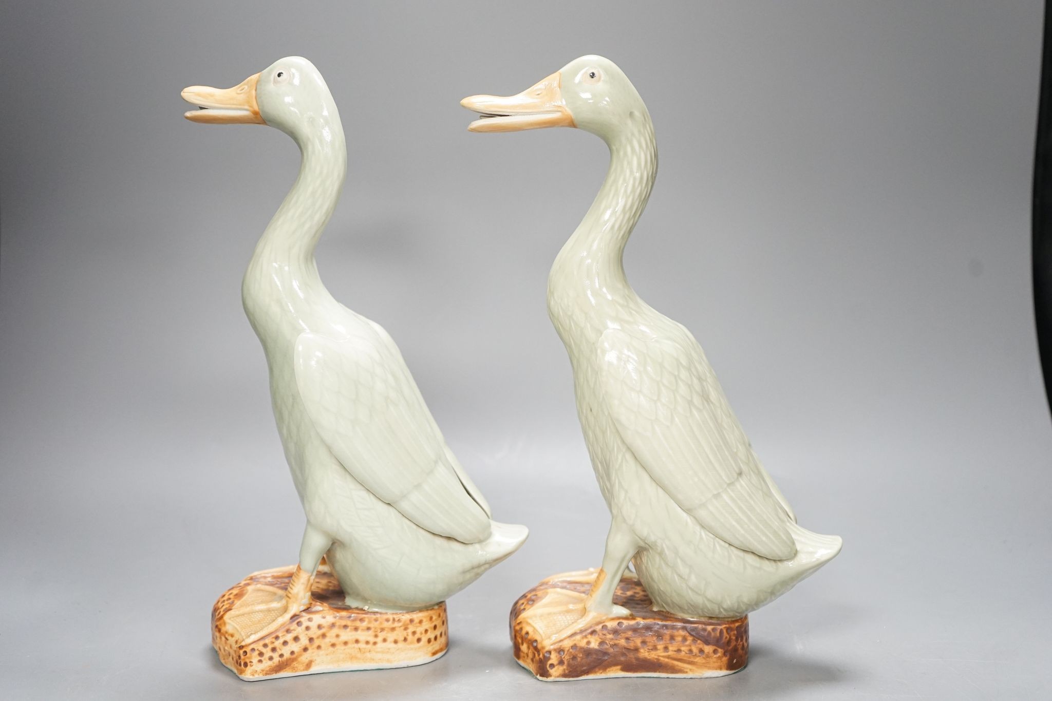 A pair of Chinese celadon glazed geese, 30cm